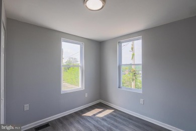 This charming end-of-row townhouse, built in 1924, seamlessly on Clifton Park Golf Course in Maryland - for sale on GolfHomes.com, golf home, golf lot