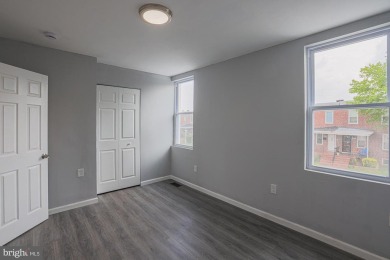 This charming end-of-row townhouse, built in 1924, seamlessly on Clifton Park Golf Course in Maryland - for sale on GolfHomes.com, golf home, golf lot