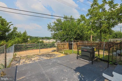 This charming end-of-row townhouse, built in 1924, seamlessly on Clifton Park Golf Course in Maryland - for sale on GolfHomes.com, golf home, golf lot
