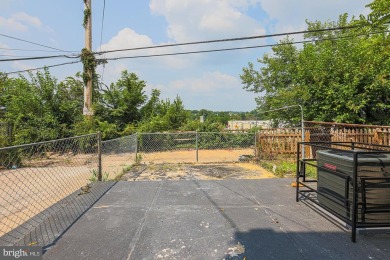 This charming end-of-row townhouse, built in 1924, seamlessly on Clifton Park Golf Course in Maryland - for sale on GolfHomes.com, golf home, golf lot