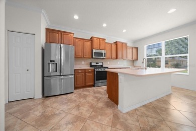 Welcome to this well-maintained 3 bedroom, 2 bath home nestled on Candler Hills Golf and Country Club in Florida - for sale on GolfHomes.com, golf home, golf lot