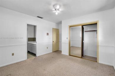 Welcome to the upscale golf-course community of Loch Lomond, one on Don Shulas Golf Course and Club in Florida - for sale on GolfHomes.com, golf home, golf lot