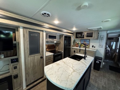 Nice corner lot with septic.  2022 one bedroom camper in on Captains Cove Golf and Yacht Club in Virginia - for sale on GolfHomes.com, golf home, golf lot