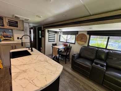 Nice corner lot with septic.  2022 one bedroom camper in on Captains Cove Golf and Yacht Club in Virginia - for sale on GolfHomes.com, golf home, golf lot