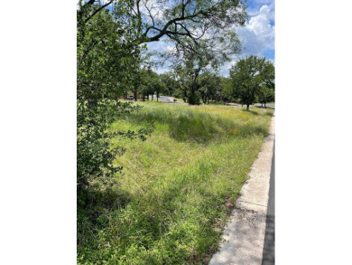 Level corner lot with trees across from Slick Rock Golf Course on Slick Rock Golf Course - Horseshoe Bay in Texas - for sale on GolfHomes.com, golf home, golf lot