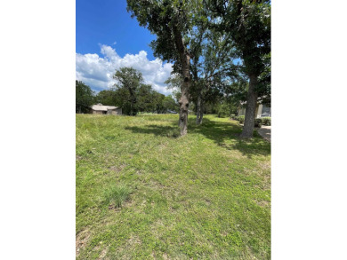 Level corner lot with trees across from Slick Rock Golf Course on Slick Rock Golf Course - Horseshoe Bay in Texas - for sale on GolfHomes.com, golf home, golf lot