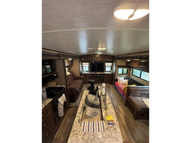 Lot with lots of extras.  Camper included is in great condition on Captains Cove Golf and Yacht Club in Virginia - for sale on GolfHomes.com, golf home, golf lot