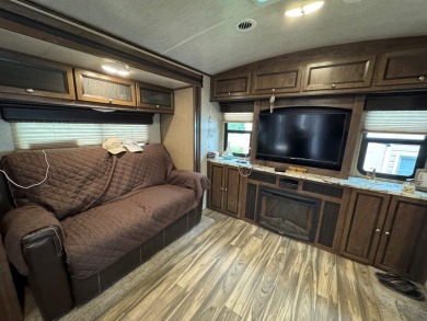 Lot with lots of extras.  Camper included is in great condition on Captains Cove Golf and Yacht Club in Virginia - for sale on GolfHomes.com, golf home, golf lot