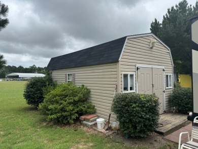 Lot with lots of extras.  Camper included is in great condition on Captains Cove Golf and Yacht Club in Virginia - for sale on GolfHomes.com, golf home, golf lot