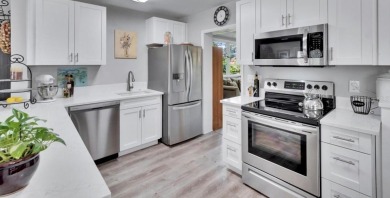 Welcome to this beautifully updated 3-bedroom, 2-bathroom on The Dunedin Country Club in Florida - for sale on GolfHomes.com, golf home, golf lot