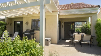 Nestled in the highly sought-after gated community of Palm on Palm Desert Resort Country Club in California - for sale on GolfHomes.com, golf home, golf lot
