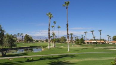 Nestled in the highly sought-after gated community of Palm on Palm Desert Resort Country Club in California - for sale on GolfHomes.com, golf home, golf lot