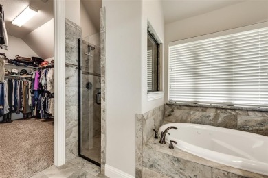 Elegant 1.5-story home at 2000 Fox Bend Trace in the Bridges at on The Bridges Golf Club in Texas - for sale on GolfHomes.com, golf home, golf lot
