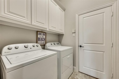 Elegant 1.5-story home at 2000 Fox Bend Trace in the Bridges at on The Bridges Golf Club in Texas - for sale on GolfHomes.com, golf home, golf lot