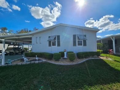 This 1995 Palm Harbor has lovely pond views and (no water on Big Cypress Golf and Country Club in Florida - for sale on GolfHomes.com, golf home, golf lot