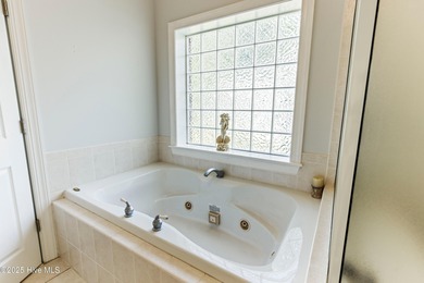 Experience the best of coastal Carolina living in this elegant on Carolina National Golf Club in North Carolina - for sale on GolfHomes.com, golf home, golf lot