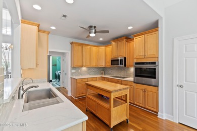 Experience the best of coastal Carolina living in this elegant on Carolina National Golf Club in North Carolina - for sale on GolfHomes.com, golf home, golf lot