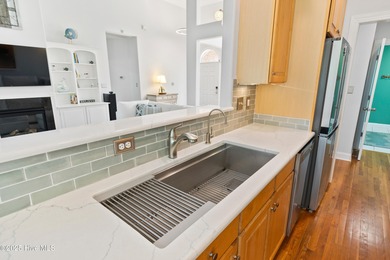 Experience the best of coastal Carolina living in this elegant on Carolina National Golf Club in North Carolina - for sale on GolfHomes.com, golf home, golf lot