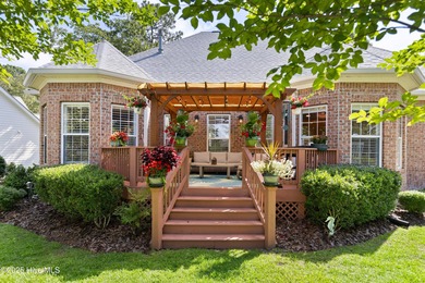 Experience the best of coastal Carolina living in this elegant on Carolina National Golf Club in North Carolina - for sale on GolfHomes.com, golf home, golf lot