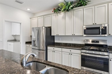 This Beautiful LIGHT AND BRIGHT *Calla II Model* Home is located on Arlington Ridge Golf Club in Florida - for sale on GolfHomes.com, golf home, golf lot