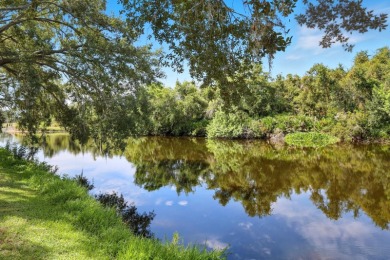 THIS LOVELY LAKEFRONT HOME IS SITUATED IN EATON PLACE, WHICH IS on University Park Country Club in Florida - for sale on GolfHomes.com, golf home, golf lot
