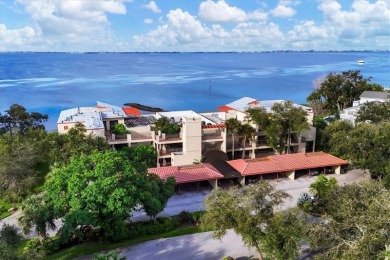 Waterfront End Unit with Breathtaking Sunsets & Natural Charm! on IMG Academies Golf and Country Club in Florida - for sale on GolfHomes.com, golf home, golf lot