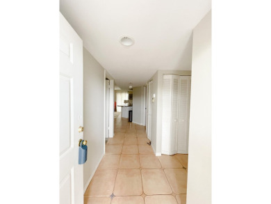 Discover this 2-bedroom, 2-bath first-floor condo in Quail on Quail Run Golf Club In Naples in Florida - for sale on GolfHomes.com, golf home, golf lot