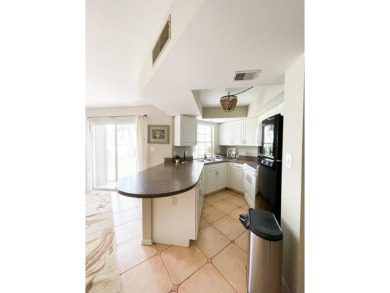 Discover this 2-bedroom, 2-bath first-floor condo in Quail on Quail Run Golf Club In Naples in Florida - for sale on GolfHomes.com, golf home, golf lot