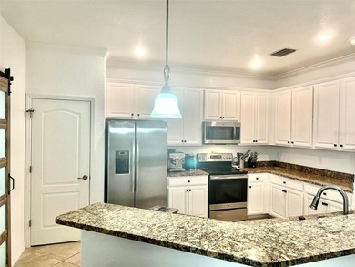 Stunning 4-bed, 2-bath home in renowned River Strand Golf and on River Strand Golf and Country Club At Heritage Harbour  in Florida - for sale on GolfHomes.com, golf home, golf lot