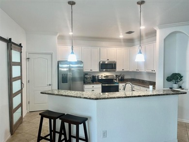 Stunning 4-bed, 2-bath home in renowned River Strand Golf and on River Strand Golf and Country Club At Heritage Harbour  in Florida - for sale on GolfHomes.com, golf home, golf lot