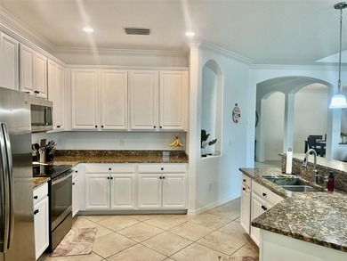 Stunning 4-bed, 2-bath home in renowned River Strand Golf and on River Strand Golf and Country Club At Heritage Harbour  in Florida - for sale on GolfHomes.com, golf home, golf lot