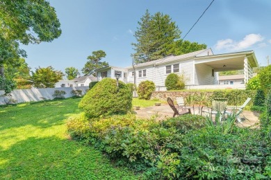 This stylish ranch home with mid century modern touches is a on Asheville Municipal Golf Course in North Carolina - for sale on GolfHomes.com, golf home, golf lot