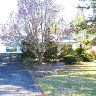 This stylish ranch home with mid century modern touches is a on Asheville Municipal Golf Course in North Carolina - for sale on GolfHomes.com, golf home, golf lot