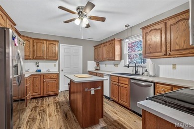 Water view sprawling ranch  home in beautiful Raintreee on Raintree Country Club in Missouri - for sale on GolfHomes.com, golf home, golf lot