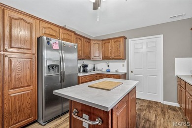 Water view sprawling ranch  home in beautiful Raintreee on Raintree Country Club in Missouri - for sale on GolfHomes.com, golf home, golf lot