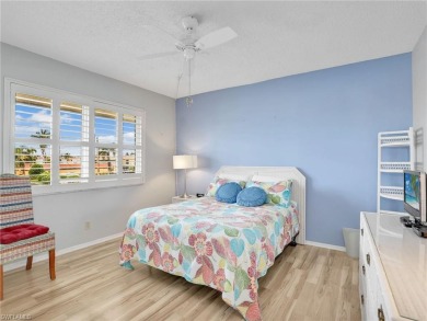 Discover this charming 2-bedroom, 2-bath waterfront home on The Glades Golf and Country Club in Florida - for sale on GolfHomes.com, golf home, golf lot