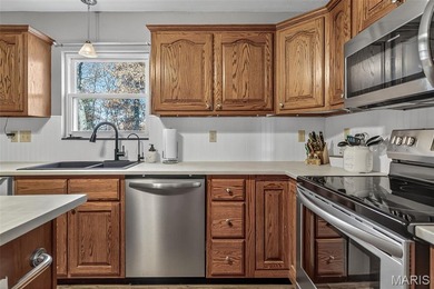 Water view sprawling ranch  home in beautiful Raintreee on Raintree Country Club in Missouri - for sale on GolfHomes.com, golf home, golf lot