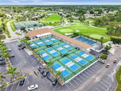 Discover this charming 2-bedroom, 2-bath waterfront home on The Glades Golf and Country Club in Florida - for sale on GolfHomes.com, golf home, golf lot