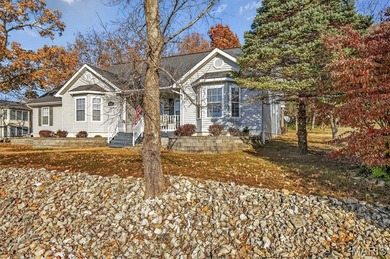 Water view sprawling ranch  home in beautiful Raintreee on Raintree Country Club in Missouri - for sale on GolfHomes.com, golf home, golf lot