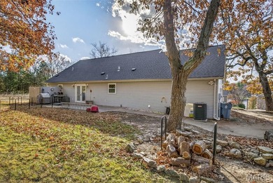 Water view sprawling ranch  home in beautiful Raintreee on Raintree Country Club in Missouri - for sale on GolfHomes.com, golf home, golf lot