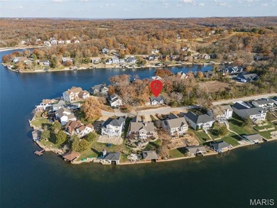 Water view sprawling ranch  home in beautiful Raintreee on Raintree Country Club in Missouri - for sale on GolfHomes.com, golf home, golf lot