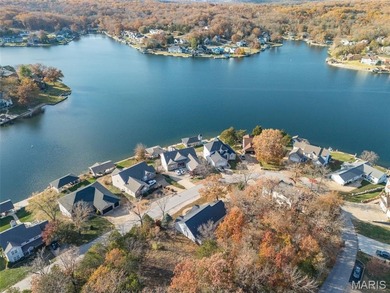 Water view sprawling ranch  home in beautiful Raintreee on Raintree Country Club in Missouri - for sale on GolfHomes.com, golf home, golf lot