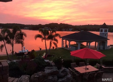 Water view sprawling ranch  home in beautiful Raintreee on Raintree Country Club in Missouri - for sale on GolfHomes.com, golf home, golf lot