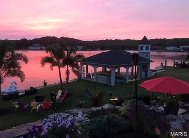 Water view sprawling ranch  home in beautiful Raintreee on Raintree Country Club in Missouri - for sale on GolfHomes.com, golf home, golf lot