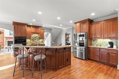 Wake up every day to sweeping golf course views overlooking the on Woodmont Golf and Country Club in Georgia - for sale on GolfHomes.com, golf home, golf lot