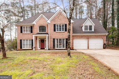 Stunning beauty surrounds this graceful home in Brookstone on Brookstone Golf and Country Club in Georgia - for sale on GolfHomes.com, golf home, golf lot