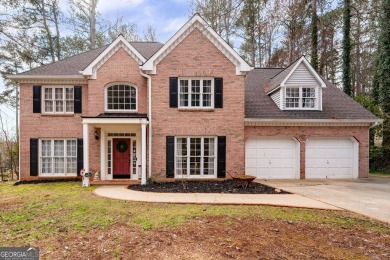 Stunning beauty surrounds this graceful home in Brookstone on Brookstone Golf and Country Club in Georgia - for sale on GolfHomes.com, golf home, golf lot