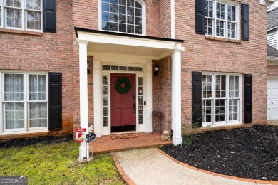 Stunning beauty surrounds this graceful home in Brookstone on Brookstone Golf and Country Club in Georgia - for sale on GolfHomes.com, golf home, golf lot