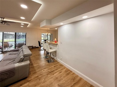 Enjoy a luxury condo living experience at The Trellises at on Jacaranda Golf Club in Florida - for sale on GolfHomes.com, golf home, golf lot