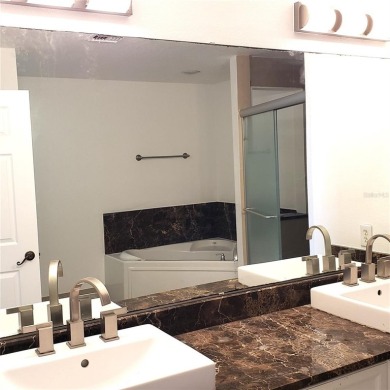 Spacious 3-Bedroom, 2-Bath Condo with Lake View - Prime Orlando on MetroWest Golf Club in Florida - for sale on GolfHomes.com, golf home, golf lot